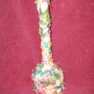A spoon made of yarn and colored paper.