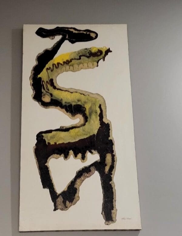 A painting of SNAKE hanging on a wall.