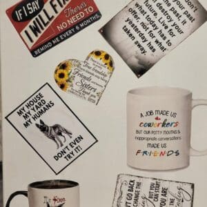 An arrangement of coffee mugs and signs with sayings.